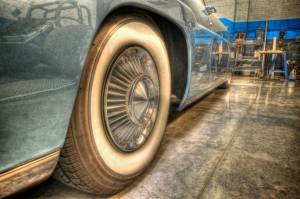 closeup vintage car with wheel in garage