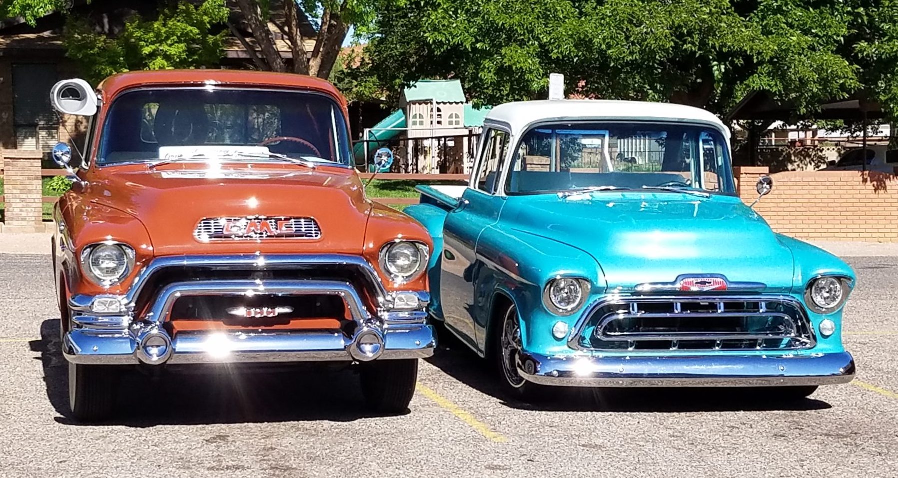 dark orange and bright blue vintage cars parked