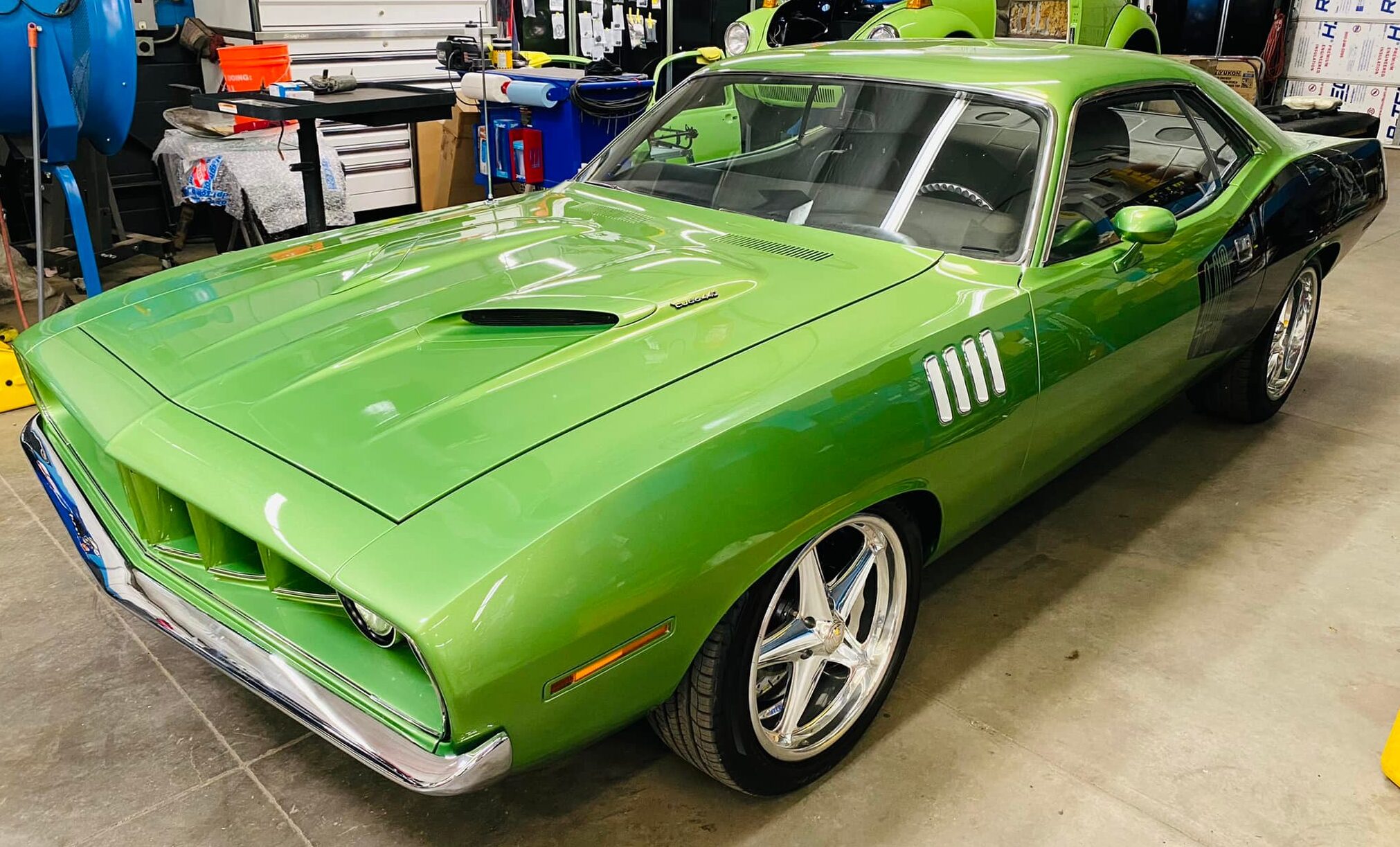 lime green vintage car parked in garage