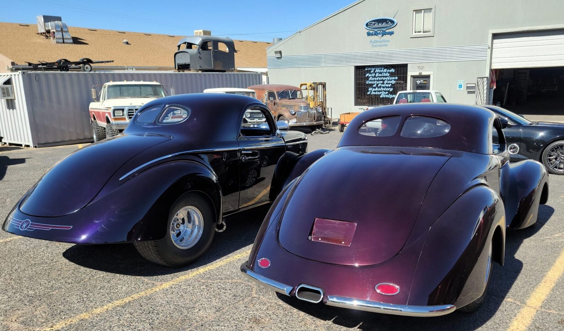 rear view of black and maroon vintage car